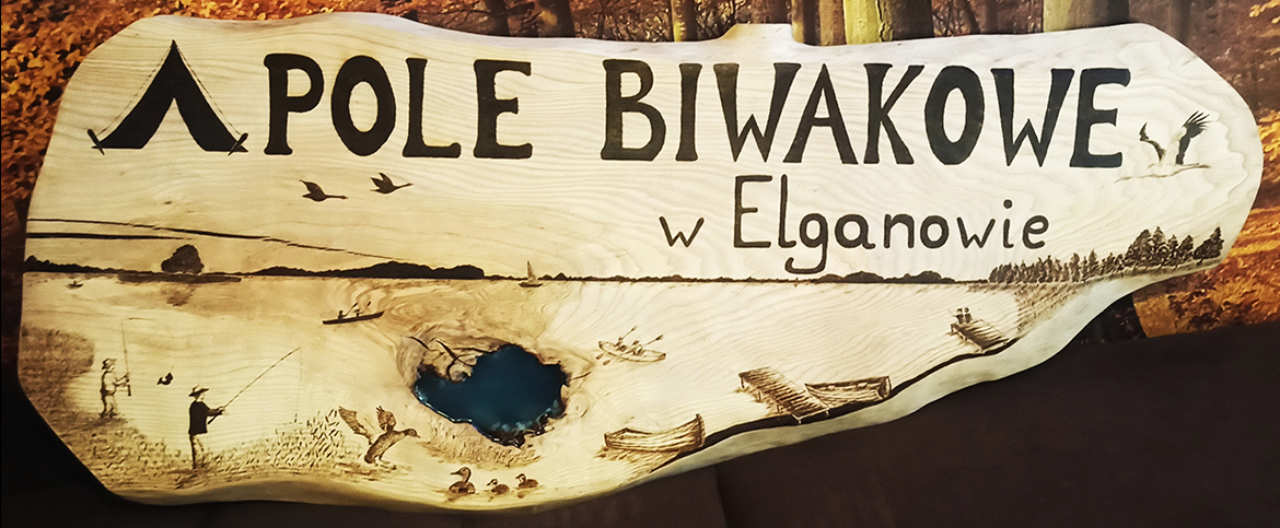 Szyld „Pole biwakowe w Elganowie”